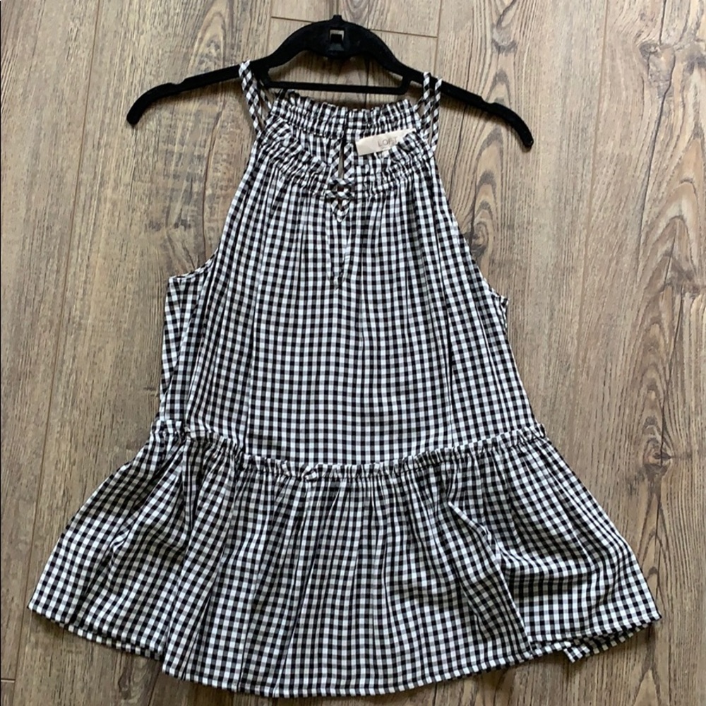 Black and white check peplum top, one once.